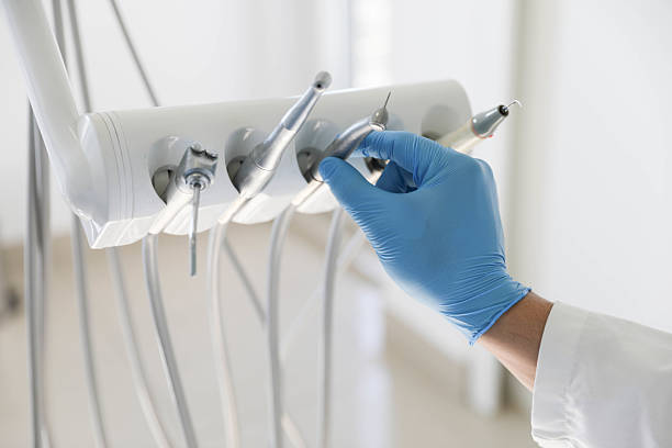 Professional Invisalign Clear Aligners technician working in Thompson, ND